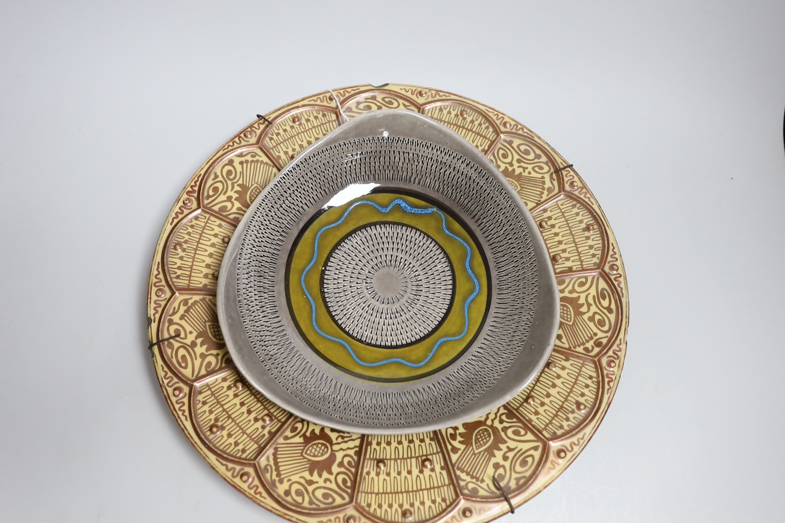 A Spanish Hispano-Moresque lustre charger, a Clarice Cliff Bizarre plate and a German bowl, largest 35cm